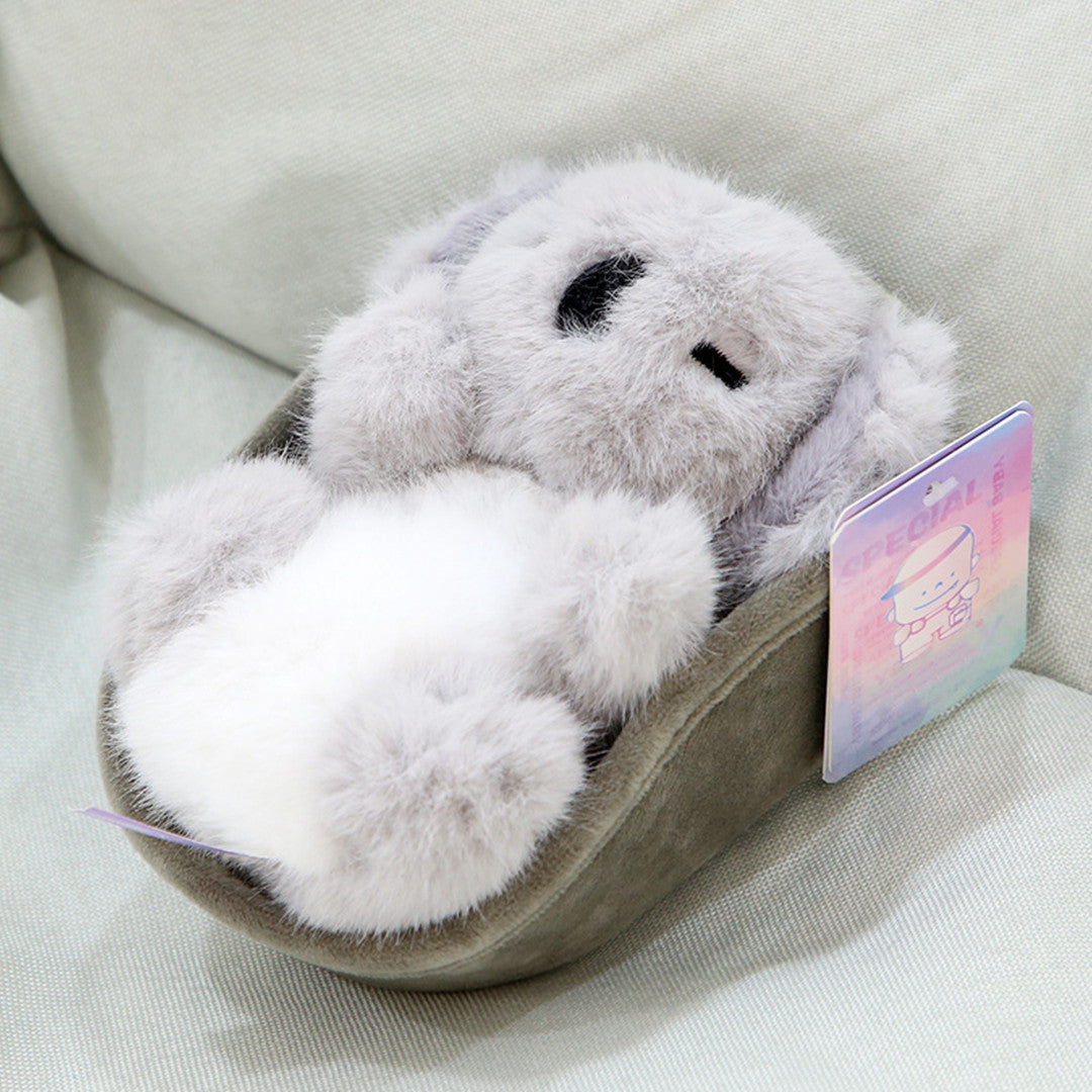 Peluche bébé animal dans un berceau